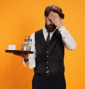 Waiter/male server looks frustrated
